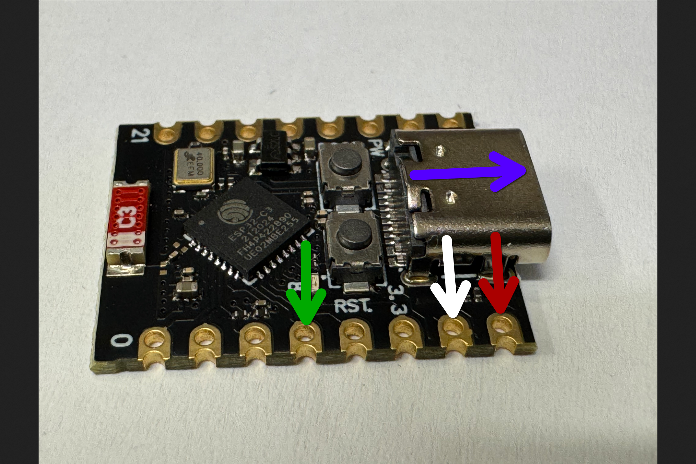 Picture of the microcontroller with labeled arrows pointing to the relevant contacts